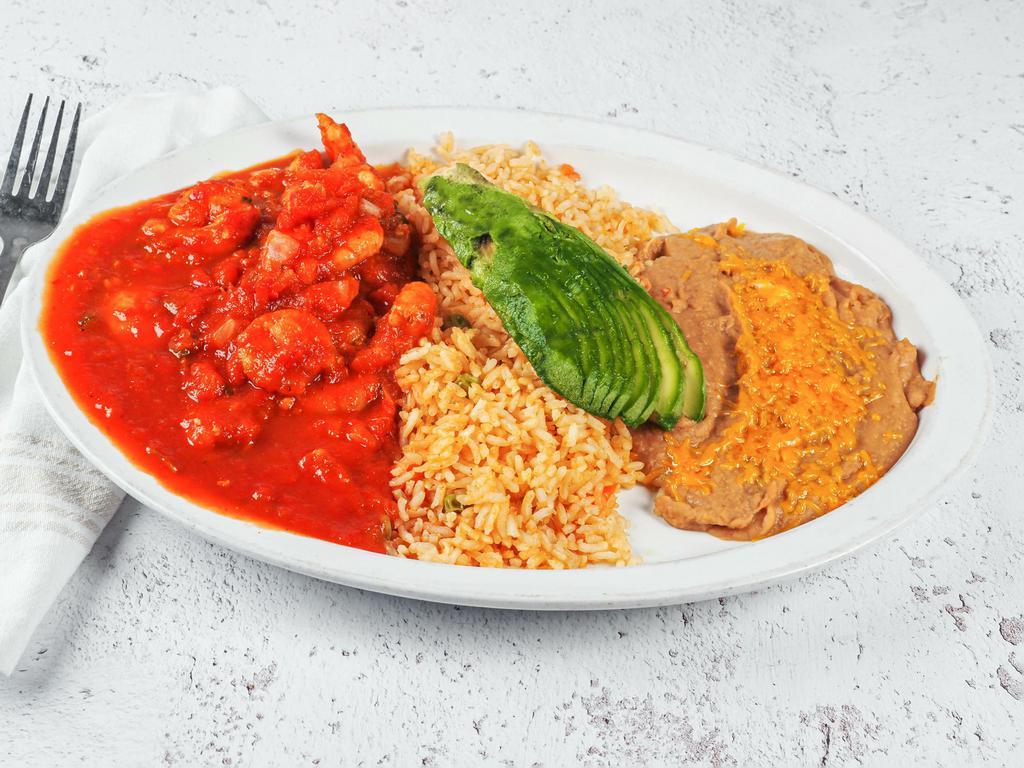 Camarones a la Diabla · Shrimp cooked in red valentina sauce and pico de gallo, served with rice and beans.