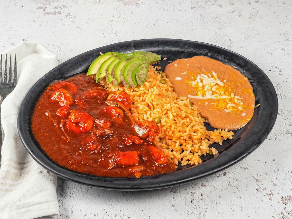 Camarones en Chipotle · 12 shrimp cooked in salsa chipotle and pico de gallo served with rice and beans.