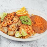 Shrimp and Fish al Mojo de Ajo · Served with rice and beans.
