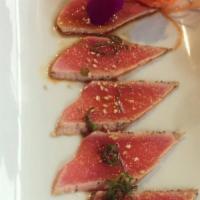 Peppered Tuna · Seared peppered tuna, scallions, served with citrus garlic butter.