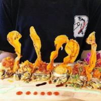 Rocky Mountain · White fish, scallion, snow crab, topped with Cajun crawfish, masago, cilantro, served with s...