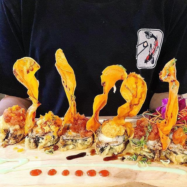 Rocky Mountain · White fish, scallion, snow crab, topped with Cajun crawfish, masago, cilantro, served with spicy mayo, eel sauce, and wasabi cream.