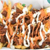 Packed Patch Spuds. · A heaping shovel of our seasoned spuds topped with grilled, seasoned Beyond Beef, melty plan...