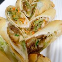 Veggie Rolls · Silver noodle cabbage, carrot, taro rolled in spring roll skin and deep fried served with sw...