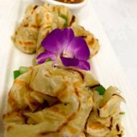 Roti · Indian style bread served with yellow curry sauce. Vegetarian. Vegan.