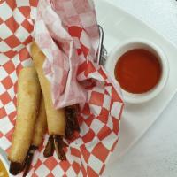 Shrimp Rolls · Deep-fried marinated shrimp rolled in spring roll skin served with sweet chili sauce.
