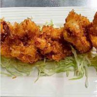 Coconut Shrimps · Deep-fried batter butterfly shrimp coated with shredded coconut served with sweet chili sauce.