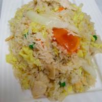 Classic Fried Rice · Jasmine rice pan-fried with choice of meat, garlic, egg, yellow onion, tomato, peas and carr...
