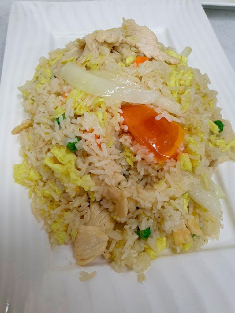 Classic Fried Rice · Jasmine rice pan-fried with choice of meat, garlic, egg, yellow onion, tomato, peas and carrot.