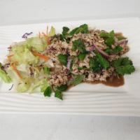 Larb Salad · Grounded chicken or pork, green onion, cilantro, mint and roasted rice powder tossed in spic...