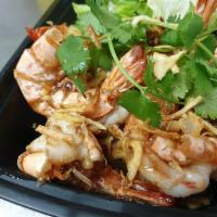 Tamarind Prawn · Jumbo prawns with the tangy flavor of tamarind sauce sprinkled with fried onion and cilantro.