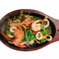 Pad Cha Seafood · A combo of shrimp, calamari and salmon, sauteed with homemade curry paste, basil, wild ginge...