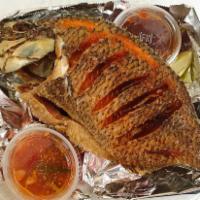Deep-Fried Whole Fish · Deep fried whole tilapia fish served with house 2 sauces on the side.