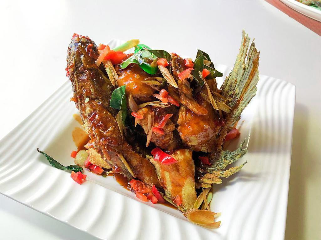 Knock out Fish · Fried whole tilapia fish, served with sweet and chili sauce on the fish.