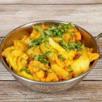 57. Aloo Gobi · Cauliflower and potatoes mixed with spices. Vegan.