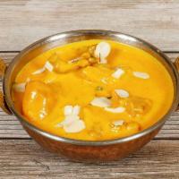 61. Chicken Korma · Medley spiced prepared with yogurt, spices, curry sauce and nuts.