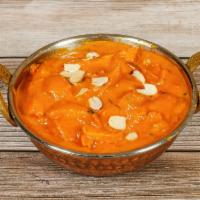63. Butter Chicken · Tandoori chicken in a sauce of tomatoes, butter and exotic spices.