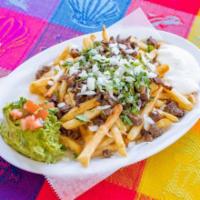 Carne Asada Fries · French fries topped with melted cheese, steak, onion, cilantro, guacamole and sour cream. In...