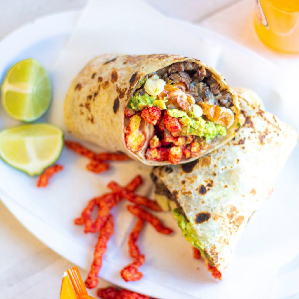 Hot Cheetos Burrito · Includes Steak, Melted Cheese, Guacamole & Hot Cheetos. Two  (1 oz) Hot Sauces per Burrito included. For extra salsa go to extra sides. 