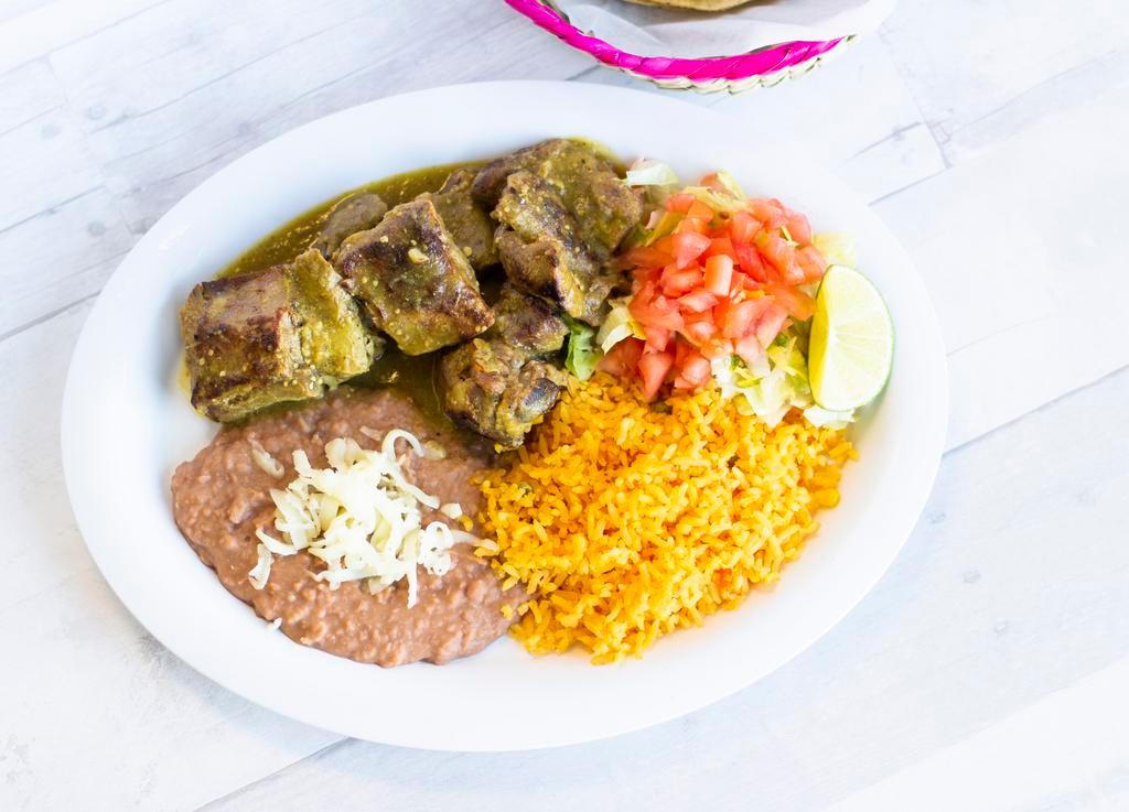Costillas de Puerco Dinner · Pork ribs in green or red sauce. Served with a side of rice, beans and salad. 6 tortillas included.