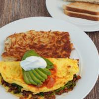 Ranchero Omelet · Three egg omelet, chorizo, spinach, Jack cheese, Spanish sauce, avocado, sour cream, hash br...