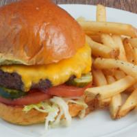 Classic Cheeseburger · American cheese, lettuce, tomatoes, pickles, Thousand Island dressing.