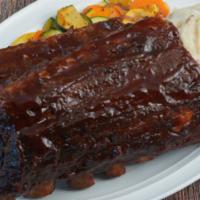 Bbq Baby Back Ribs (full Rack) · Our original tender ribs, smoky mesquite BBQ sauce, flame-broiled.