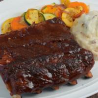 Bbq Baby Back Ribs (half Rack) · Our original tender ribs, smoky mesquite BBQ sauce, flame-broiled