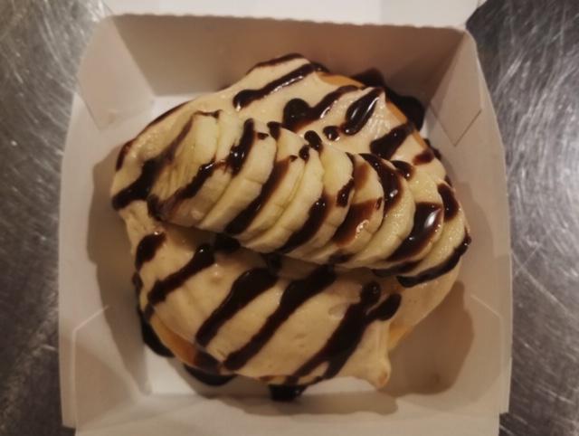 Elvis Roll · Peanut butter frosting: topped with freshly sliced bananas and chocolate sauce