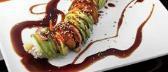 Black Dragon Roll · shrimp tempura, cucumber & mayo inside, topped with eel & avocado, with eel sauce & sesame