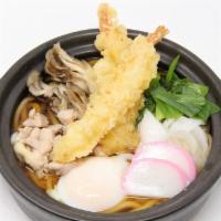 Nabe Yaki Udon · Shrimp tempura, chicken, onions, fish cake, maitake, green onions cooked in clay pot.