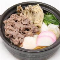 Beef Sukiyaki Nabeyaki Udon · Soft and tender kobe beef slices, soft boiled egg, enoki- mushroom, onions and fish cake.