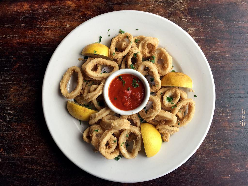 Calamari Dorati · Our version of fried calamari served with a spicy marinara sauce.