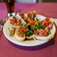 Bruschetta · Toasted ciabatta bread topped with fresh tomatoes, garlic, basil, olive oil and balsamic red...