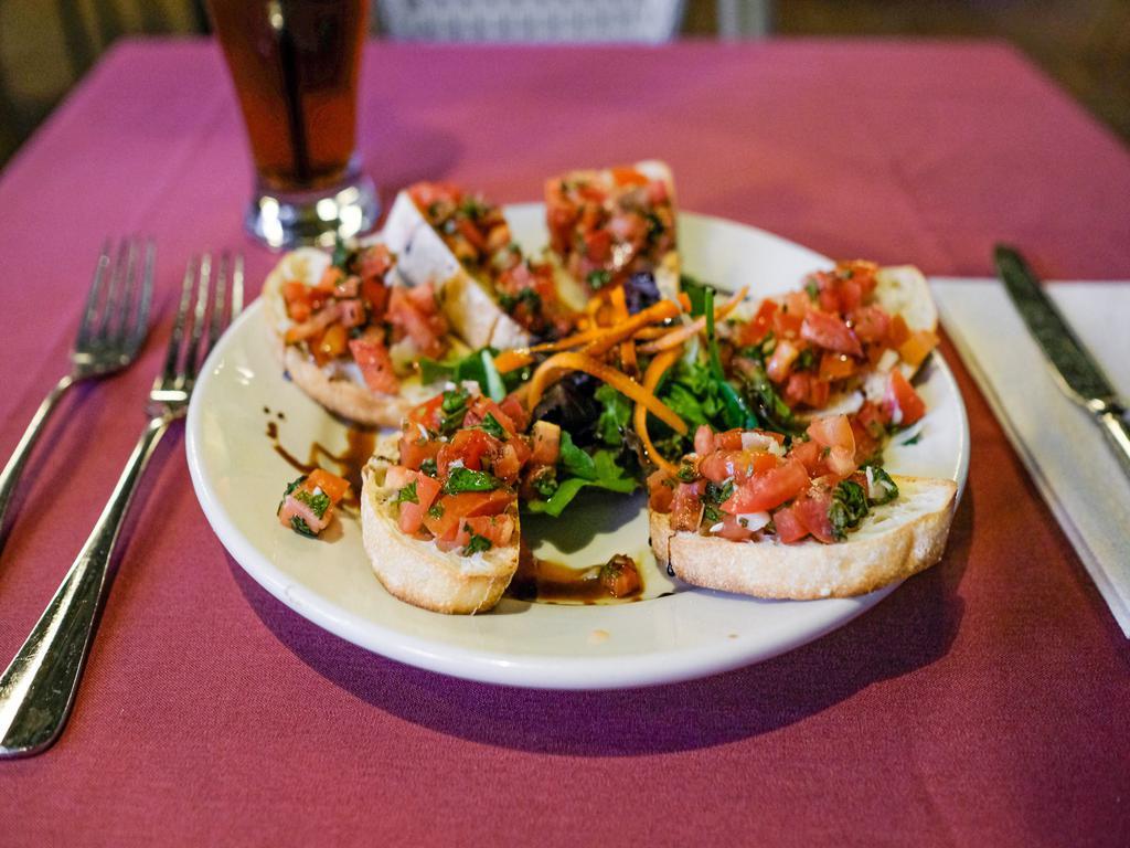 Bruschetta · Toasted ciabatta bread topped with fresh tomatoes, garlic, basil, olive oil and balsamic reduction.