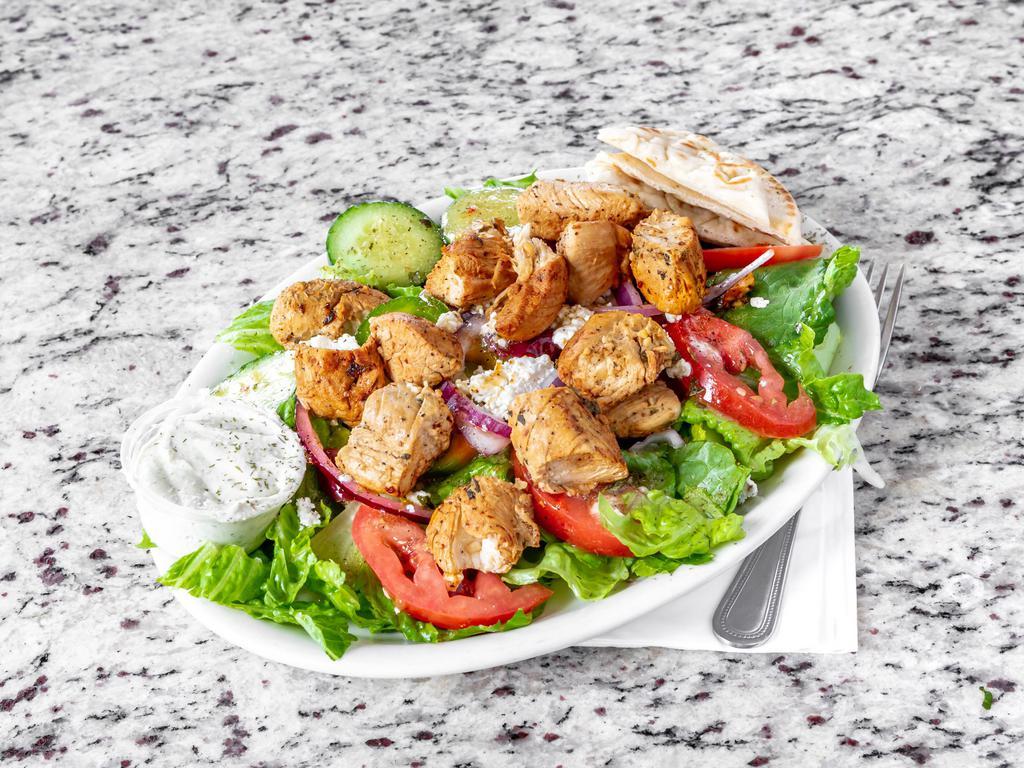 Grilled Chicken Salad · Served with Greek salad.
