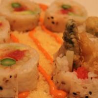 Crunch Munch Roll · Spicy tuna, masago with shrimp tempura, avocado and asparagus tempura wrapped with sesame cr...