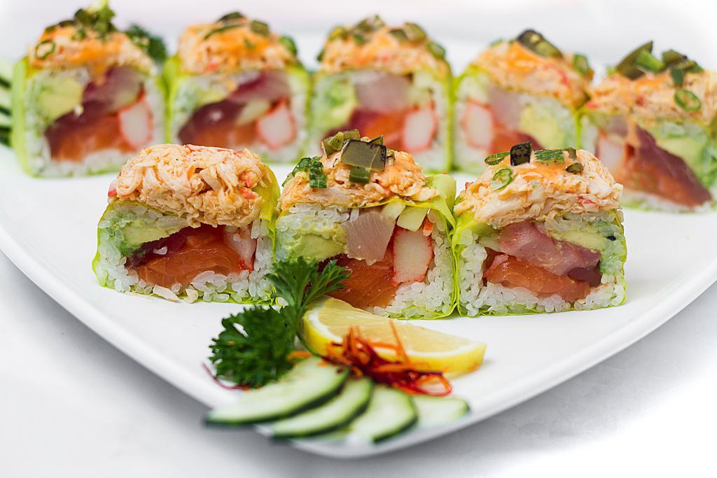 Goddess Roll · Tuna, ocean trout, yellowtail, cucumber, crabmeat, and avocado wrapped in soy paper. Topped with king crabmeat, scallion, roasted jalapeno with lime and spicy mayo sauce.