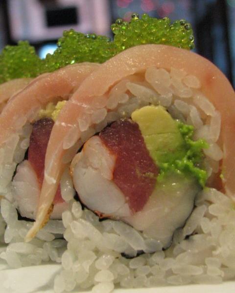 Kryptonite Roll · Fresh tuna, super white tuna, cooked shrimp and avocado. Topped with seared albacore tuna and ponzu sauce. Wasabi tobiko on top.