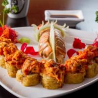 Lobster Dynamite Roll · Baked lobster with dynamite sauce over tempura roll of crab meat and cream cheese drizzled w...