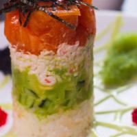 Spicy Ahi Tower with Salmon · Fresh salmon tartar in sesame oil vinaigrette and sriracha sauce over crabmeat, avocado, cuc...