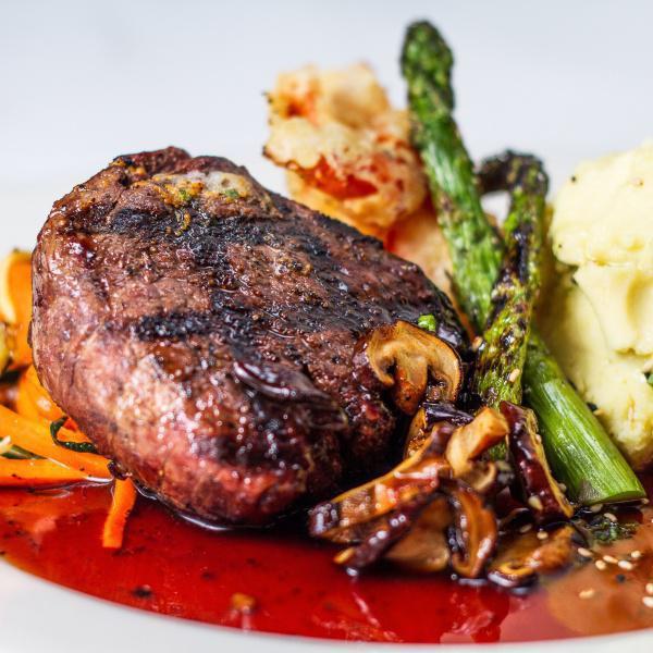 Filet Mignon · Grilled 8 oz filet mignon flamed broiled to perfection topped with  sea urchin butter, shiitake mushroom sauce. Served with assortments of simmered vegetables.