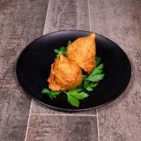 Vegetable Samosa · 2 pieces. Crispy pastry stuffed with green peas, potatoes, fresh coriander leaves with mild ...