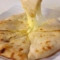 Cheese Naan · Tandoori naan stuffed with fresh mozzarella cheese and baked to perfection in a clay oven. V...