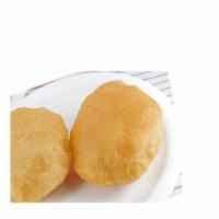 POORI (2 PCS ) · Tender and puffy wheat bread deep fried in vegetable oil. Vegetarian.