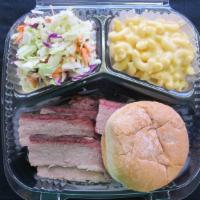 Sliced brisket plate · .Mesquite smoked sliced brisket. Includes 2 sides and a roll.
Our house made BBQ sauce serve...
