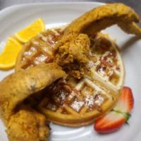 Chicken and Waffles · Two fried whole wings with a waffle.
