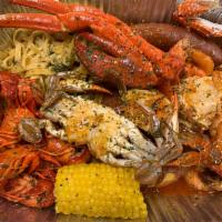 Seafood Boil Pan-Large · 1 Snow crab cluster, 1/4 pounds of shrimp, a blue crab, sausage, corn, a potato and lemon bu...