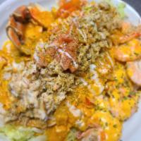 Crab and Shrimp Nachos  · This is not your traditional chicken or beef nachos. The nachos are made with beans, peppers...