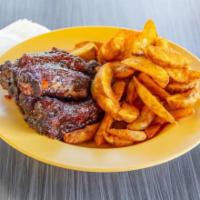 Baby Back Ribs · Comes barbequed and served with potato wedges.